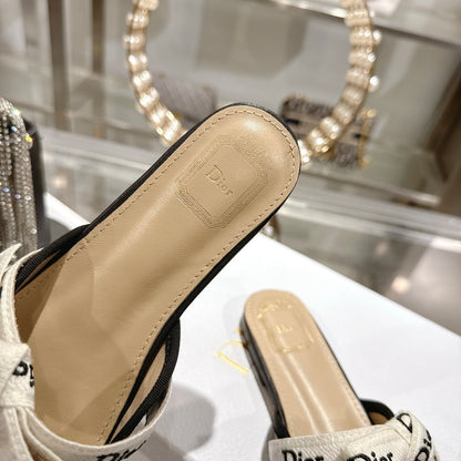 CD 26 Bow Flat Mules Embroidered Sheepskin
